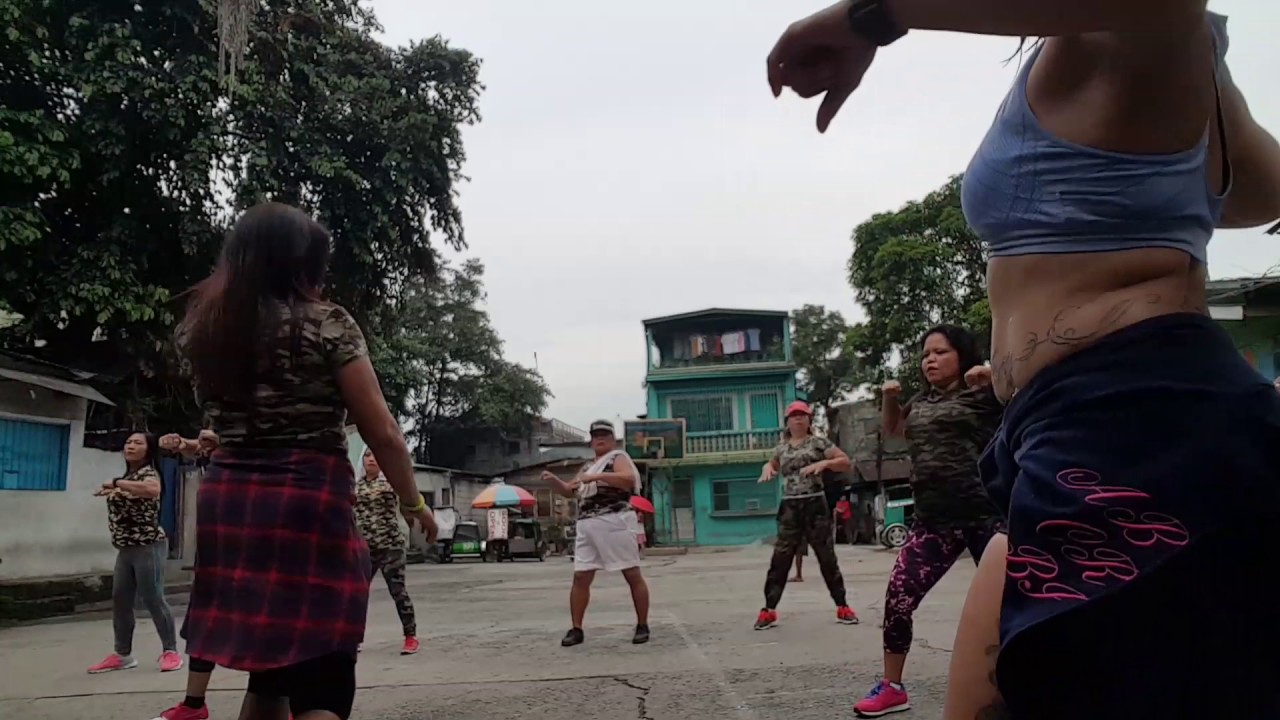 Zumba gold in camouflage dancing in the street
