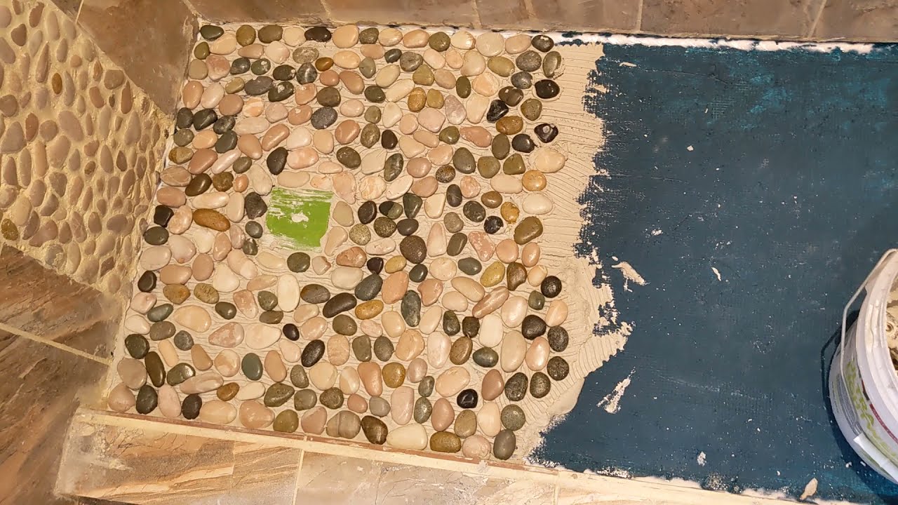 Natural River Rock shower floor project applying thinset and rocks YouTube