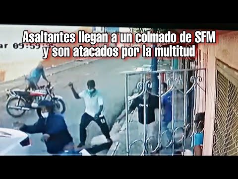 Asaltantes llegan a un colmado de SFM y son atacados por la multitud