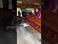 Load casket into hearse unit