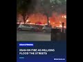 Iran lit by phone lights as crowds surge nationwide