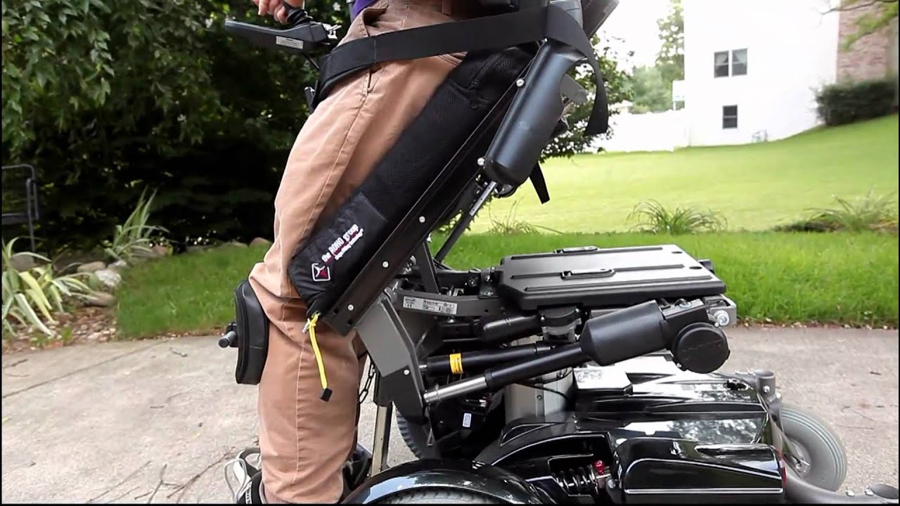 Ross stands with the Permobil c500 power wheelchair YouTube