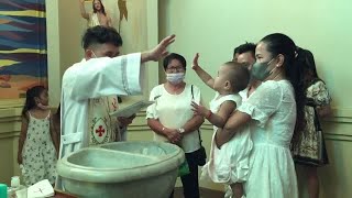 Baby high-fives priest during her own baptism #shorts