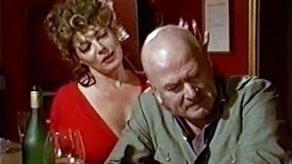 The blonde at the bar with long nails seduces man