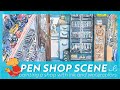 Pen shop scene with watercolors
