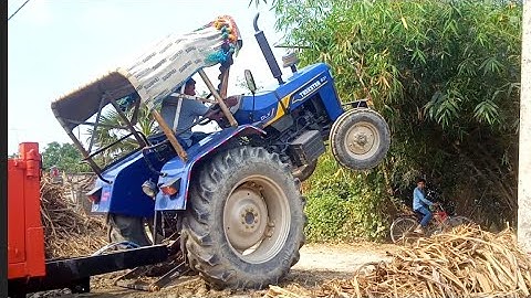 Trakstar Tractor trolley lifting Front Area || JCB Backhoe Machine loading soil in Mahindra Tractor