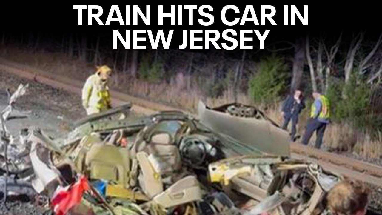 Train with 33 on board hits car on the tracks in NJ - YouTube