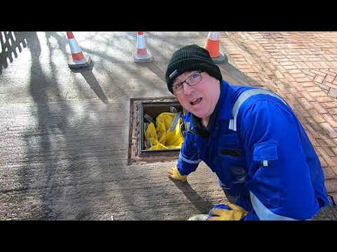 Replacing a rusty manhole cover & surround.