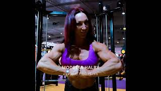 Flexing and posing session by Modesta Halby #femalebodybuilding  #muscularwomen