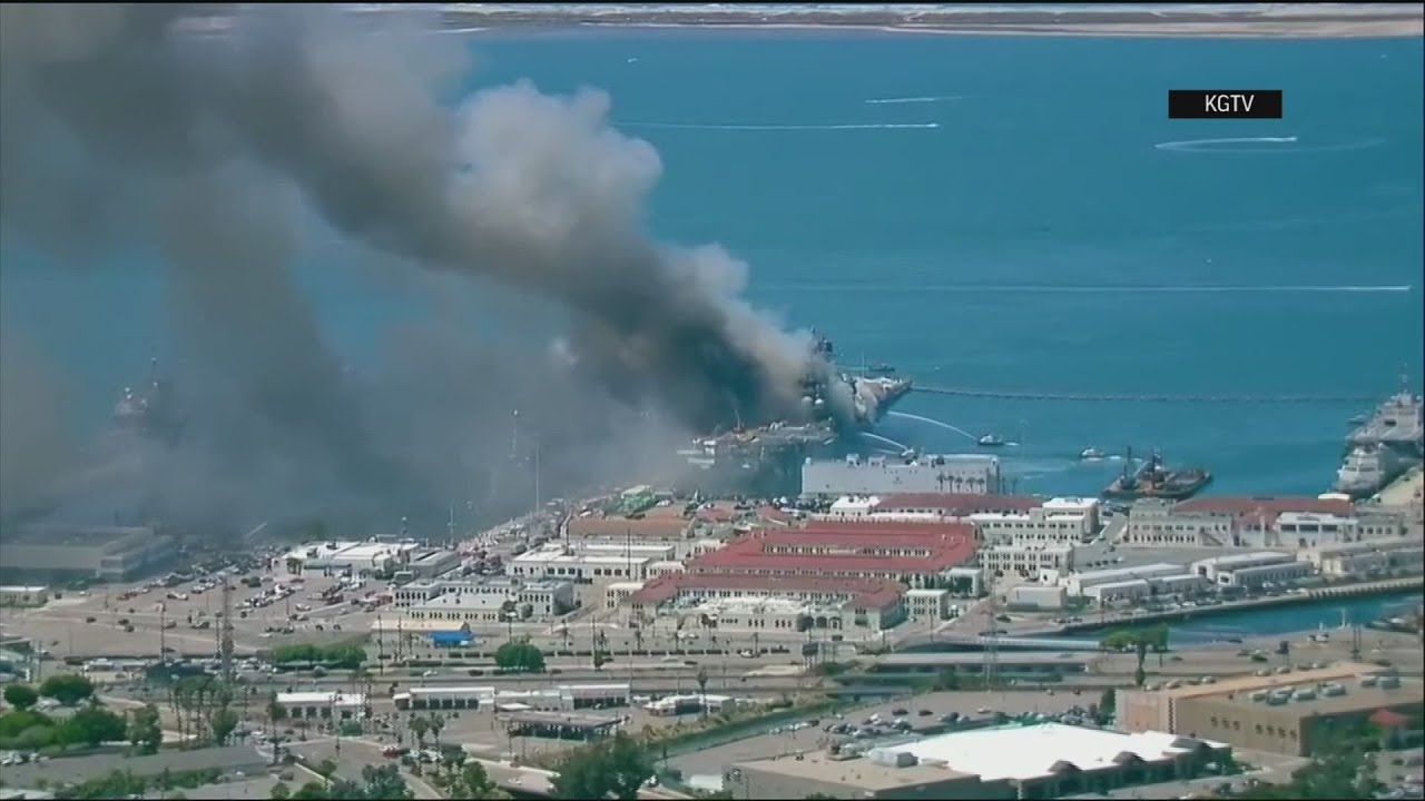 Aerials show ship ablaze at Naval Base San Diego