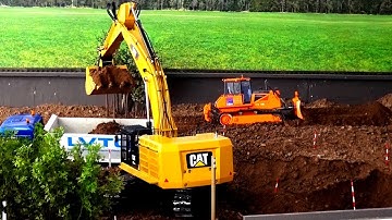 RC Dozer Excavator and Trucks building street and tunnel Construction Site in Action Part 1/3