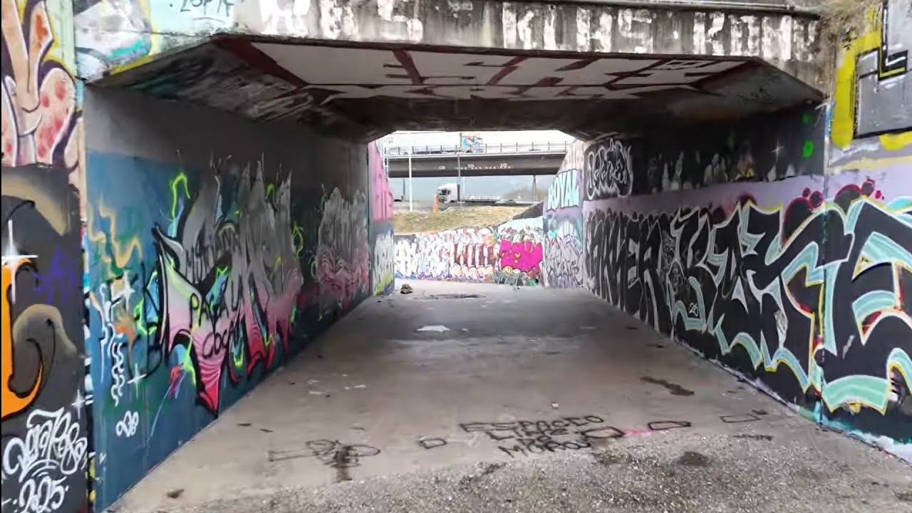 Graffiti sewers and escaping the rain. Drone in Barcelona.