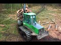 Powerful John Deere 1110D, loging in mud