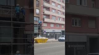 Woman Throws Water Towards Workers in Frustration of the Noise