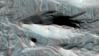 Mars Strange Volcano and Impact Features