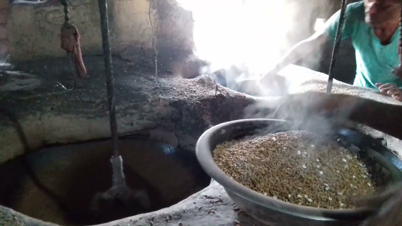 process of making beaten rice in Nepali village and also called chiura ...