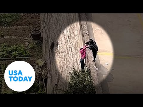 Children save a girl from falling over the wall in China | USA TODAY