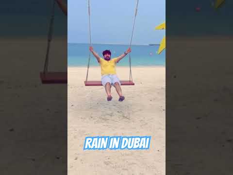 Splashing through the first rain at Dubai Island Beach – Where desert meets the sea! #dubai 🌧️ 🏖️