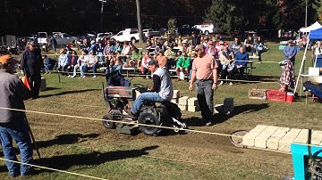 My dad on my cub 100 at the last tractor pull of the year