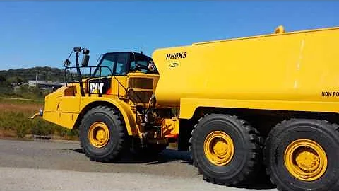 New CAT 745C 9,000 gallon water truck with front spray bar by HEC(2)