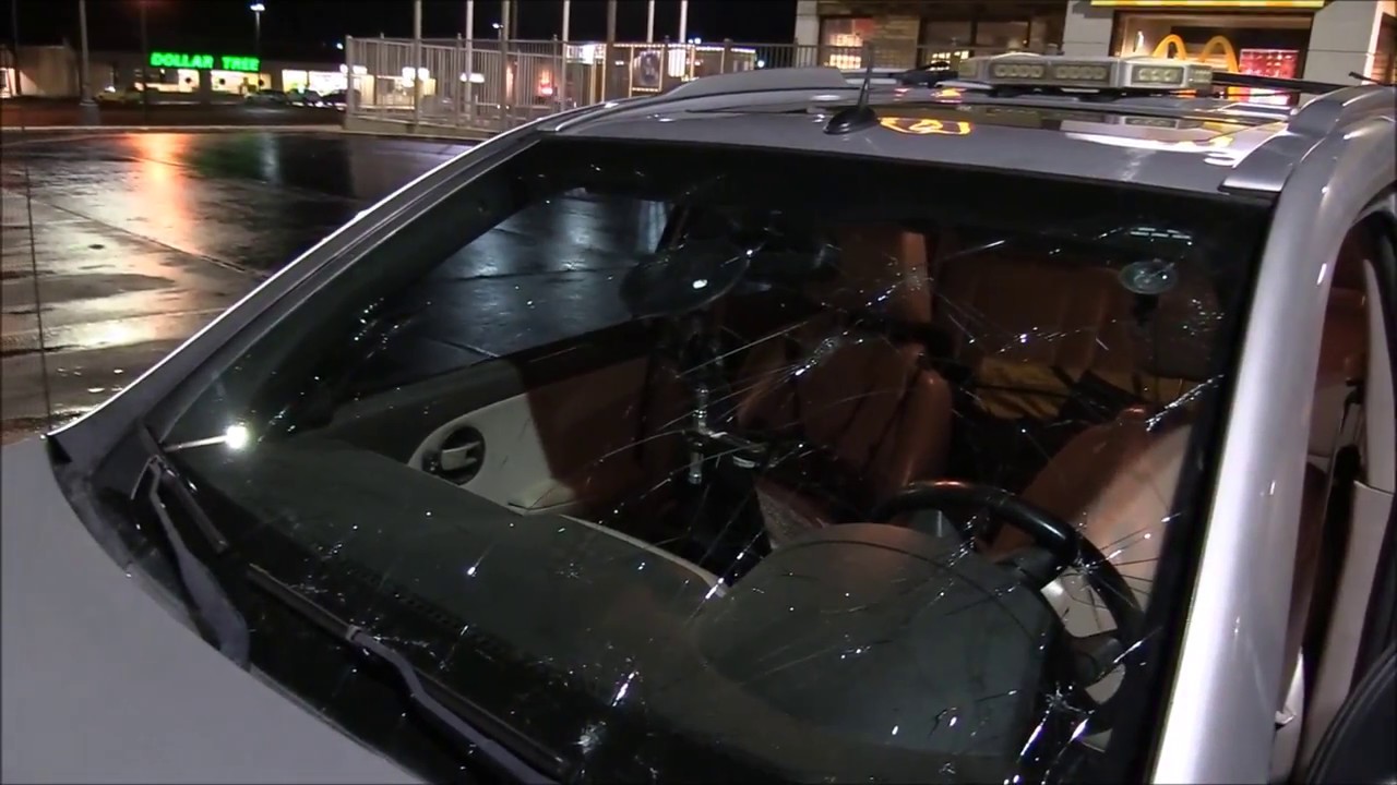 Massive hail destroys storm chasers car!! Up to tennis ball size hail ...