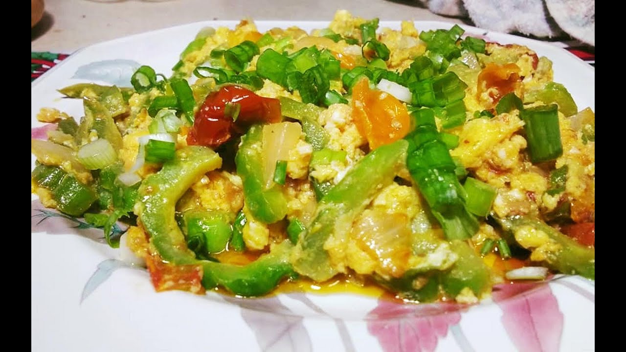 Sauteed Bitter gourd with eggs and tomato./ Ginisang Ampalaya with Egg