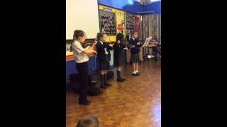 Violin performance in Assembly by Year 3 and 4 (Twinkle Twinkle Little Star)