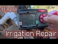 Repairing the irrigation line in the garden.