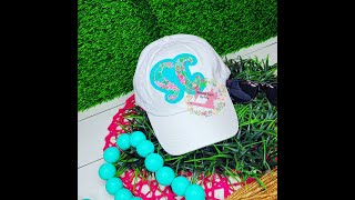 How to applique a Lalas state embroidery design on a hat.
