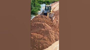 You can visit at long video dozer pushing dirt connected road water