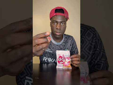African boy eats Korean  plum candy for the first time ￼