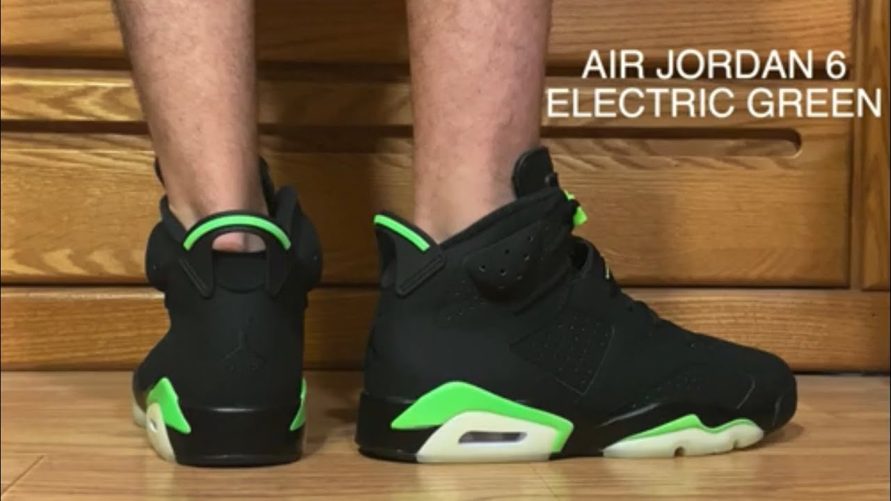 black and green jordan 6 on feet