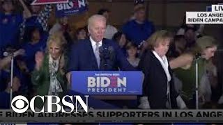 Protesters rush the stage during Biden's Super Tuesday speech