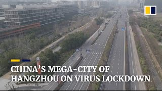 China locks down Hangzhou, mega-city far from epicentre of coronavirus outbreak