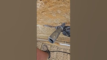 Raking out bad cement pointing from a stone wall ready to repoint with lime #stonework #repointing