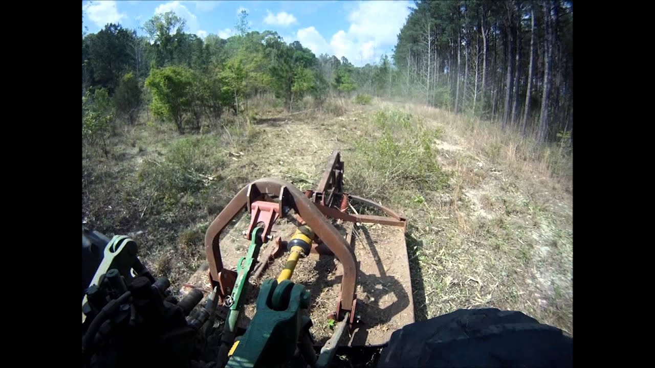 Brown Tree Cutter - Open Back Tree Cutter field clearing.wmv