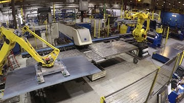 Dual Fanuc robots sheet feeding - shear, punch, and roll former