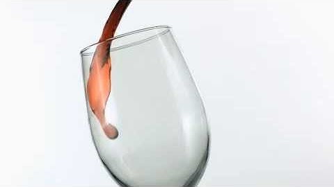 Slow Motion Red Wine Poured into Glass Footage