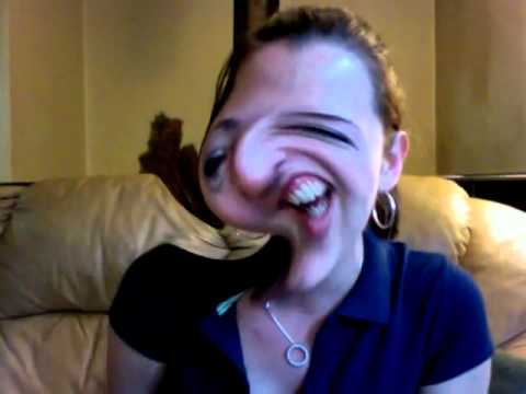 girl-laughing-while-making-funny-faces-on-distorted-webcam