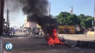 Gun-battle and fiery protest after controversial cop killing in Tivoli
