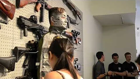 liu bolin performs 'gun rack' at eli klein fine ar...