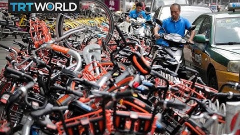 Beijing Bycycle Woes: Shared bikes clutter roads and local river