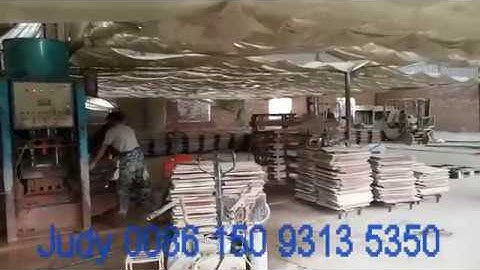 Full wet double layer terrazzo tile machine , a close-up of floor tile making machine