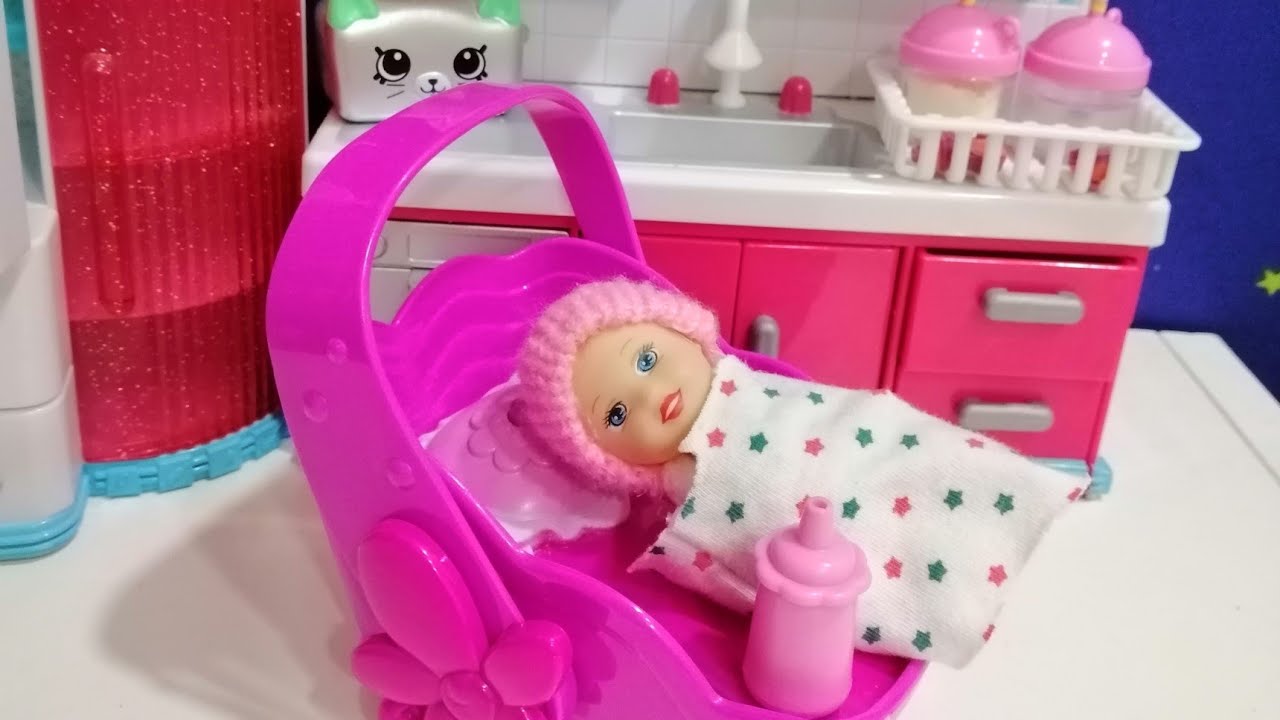 Little Girl taking care of Baby Doll 
