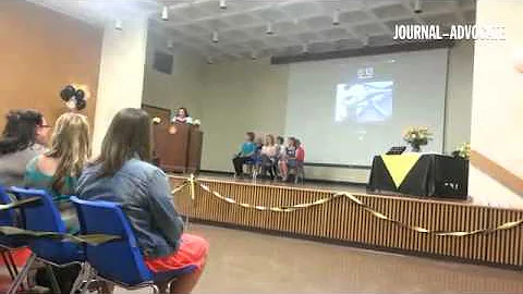 Class president Tiffany Storch gives remarks durin...