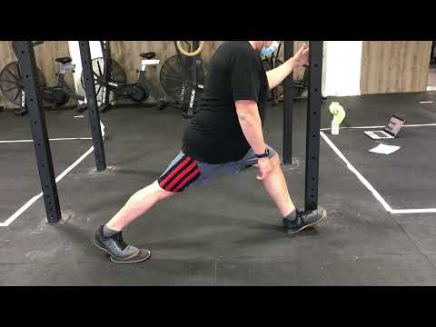 Standing eccentric hamstring with slider