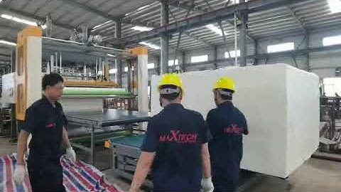 Auto compression and roll packing machine for foam blocks