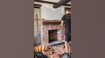 Chimney breast construction in Sunningdale with wood stove installation and reclaimed brick slips