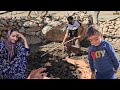 Nomadic life in Iran: the mountain man repairs the place of the sheep