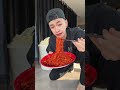 Slurping the red hot spicy noodles in a go